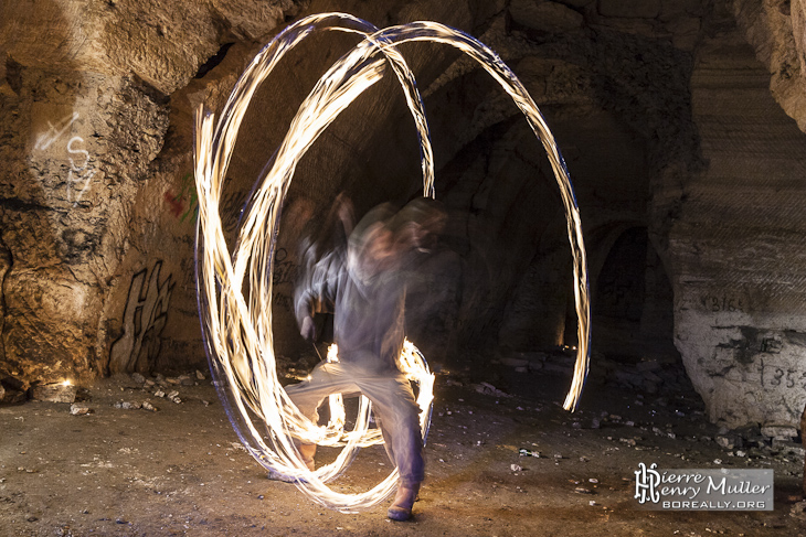 Juggler with sphere on fire at quarry of Vaux sur Seine Juggler FireQuarry Gypsum Vaux-sur-Seine Proverbes Juggler Sphere Fire